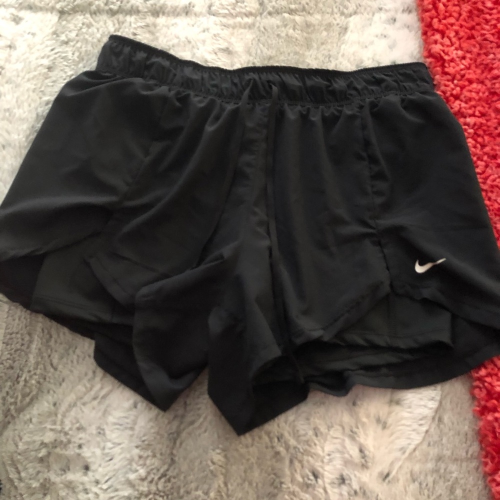 Nike women’s running shorts with spandex, size M
